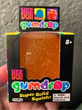 NWT NeeDoh Schylling Gumdrop Super Solid Squish! In Orange. Brand new.